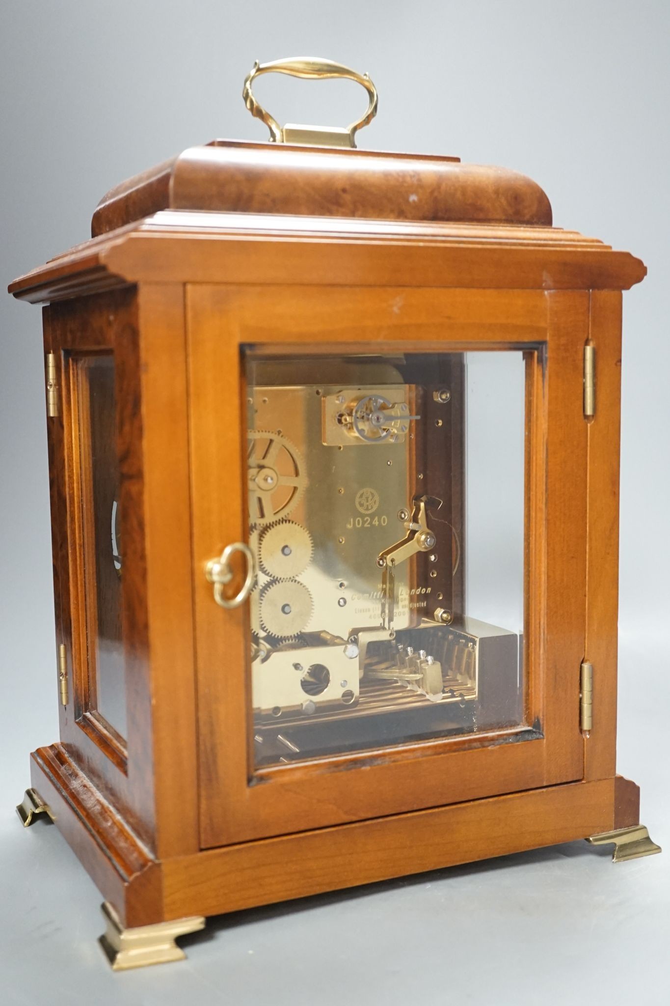 A George II style burr walnut striking and chiming eight day bracket clock, by Comitti, 32cm